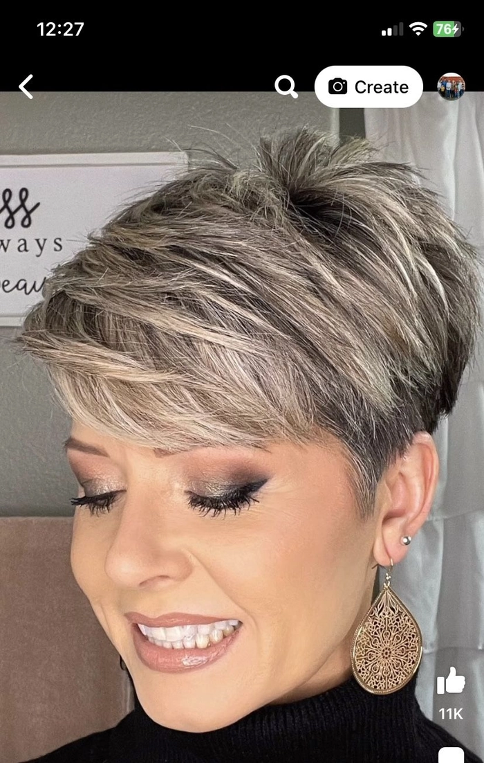 Chic very short pixie style ideal for professional settings Professional pixie cut with side-swept bangs for work