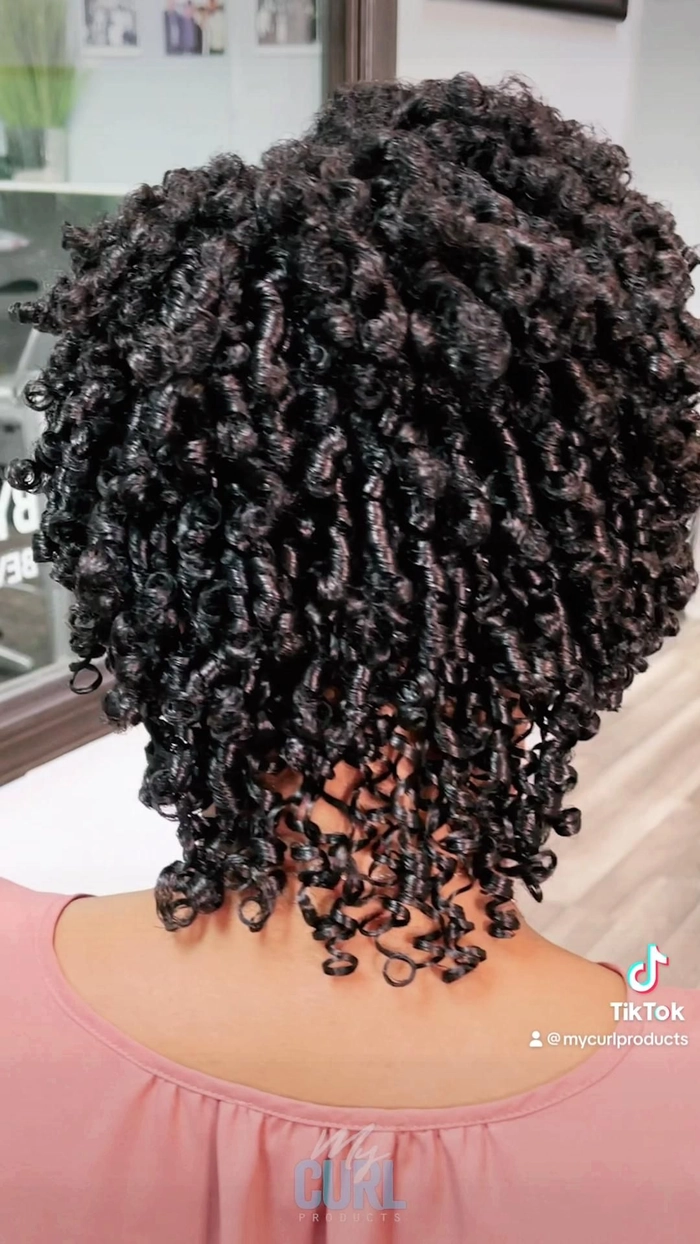 Professional wash and go style with defined natural curls suitable for the office