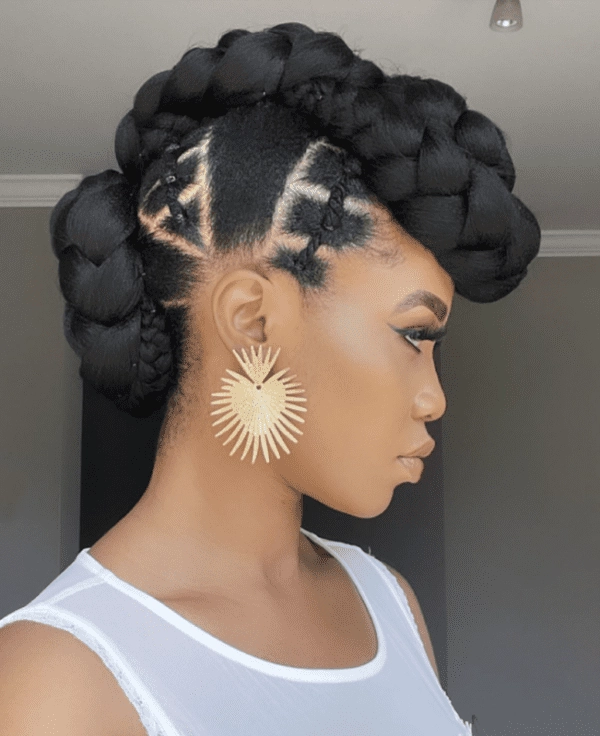 Protective low bun style for coily hair at work Woman with coily natural hair in a low bun protective style at office