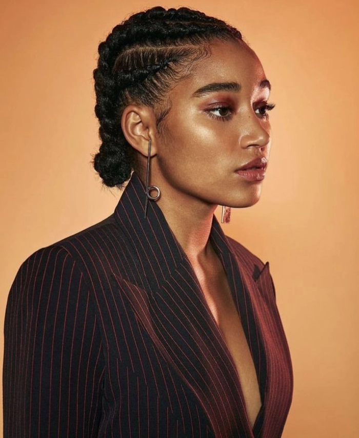 Protective Work Styles for Coily Natural Hair – Professional Updo Example Coily natural hair styled in a protective updo for a professional work environment