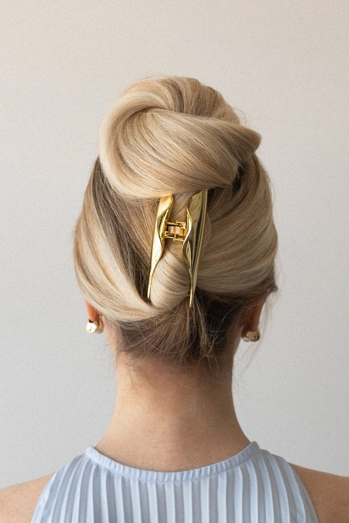 Quick claw clip updo for corporate casual Fridays with neat hair style