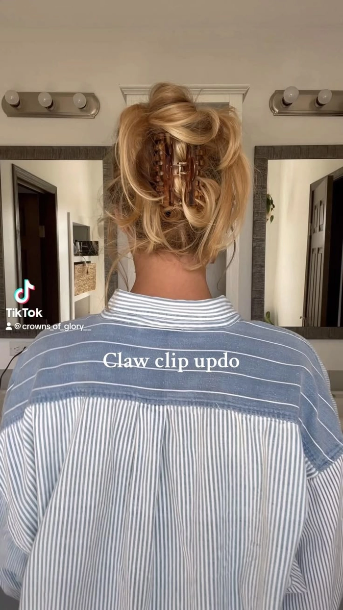 A woman with a quick claw clip updo styled for a corporate casual Friday office look
