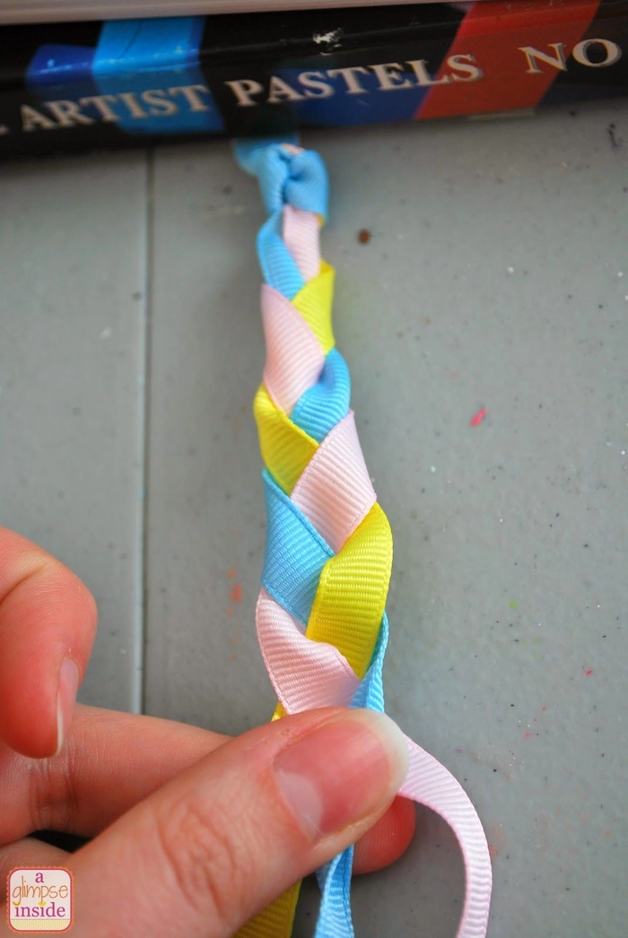 Professional braid style with ribbon woven through, suitable for office wear