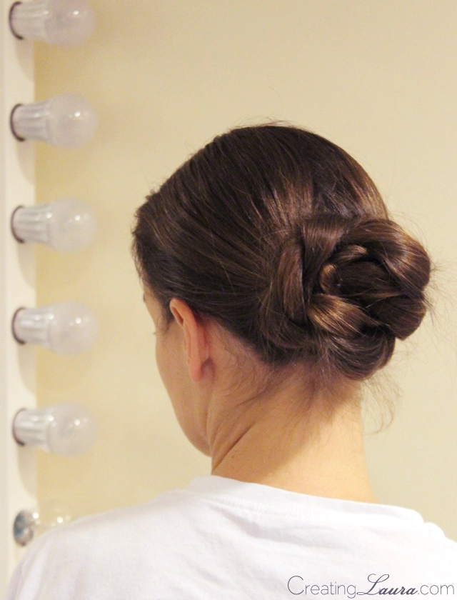 Elegant rope twist bun hairstyle for corporate dinner events