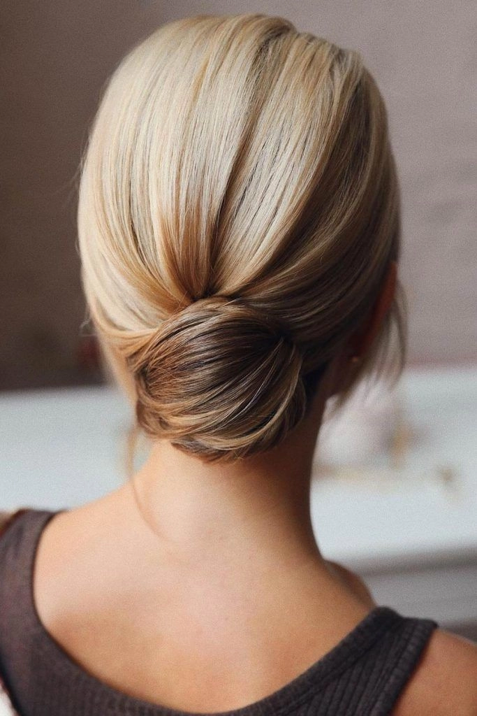 Elegant secure work bun for long hair Waist-length hair styled into a secure work bun