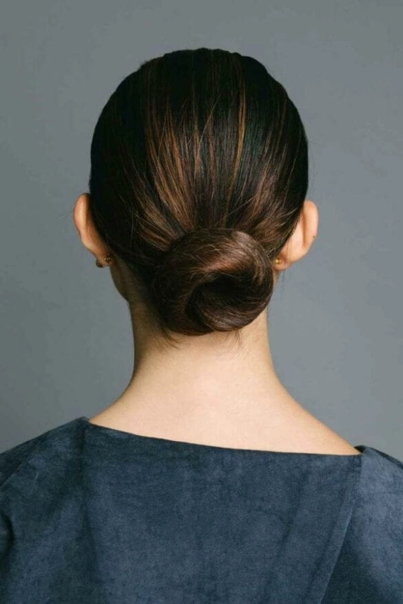 Professional secure work bun for waist-length hair Waist-length hair styled into a secure work bun for a professional look