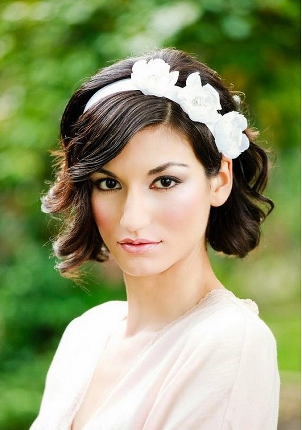 Elegant short hairstyle with minimal metallic barrette in a corporate office setting