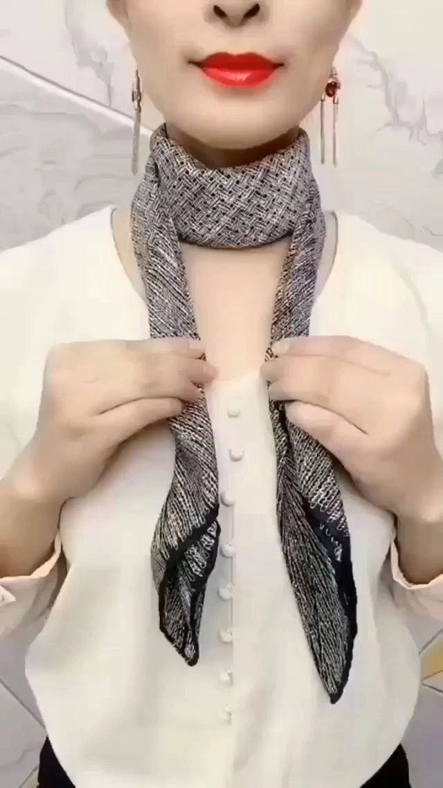 Step-by-step wrapping a silk scarf around a low chignon for a polished office look