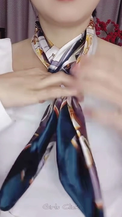 Silk scarf tied into a sleek, professional updo for the office