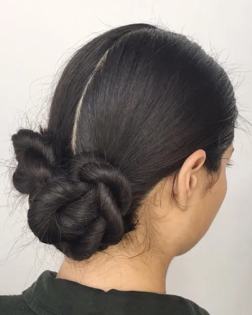 A sleek low bun hairstyle ideal for professional job interviews