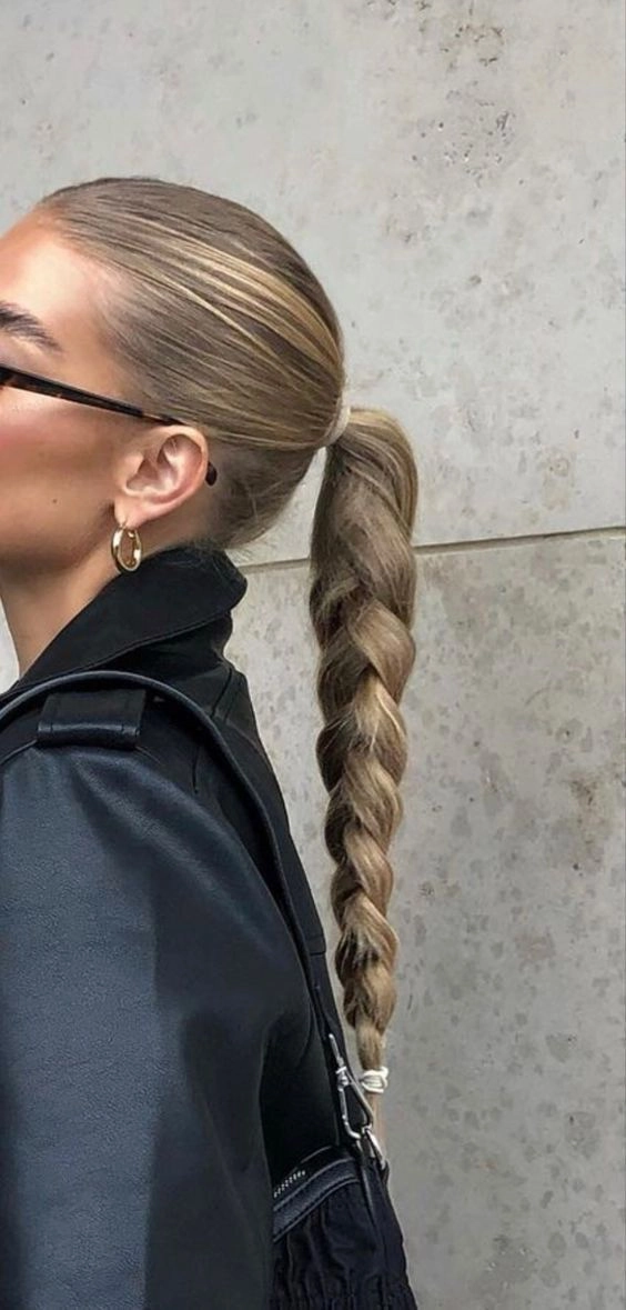 Sleek low bun hairstyle for job interview with smooth finish