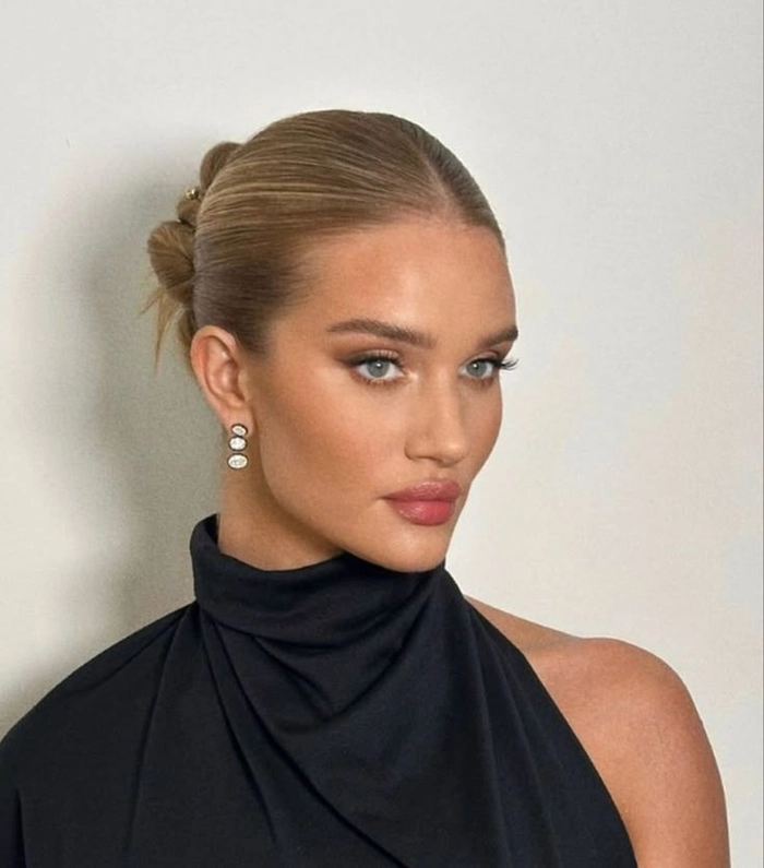 Polished low bun with middle part for executive boardroom meetings Sleek middle part low bun hairstyle for executive presentations, polished and professional