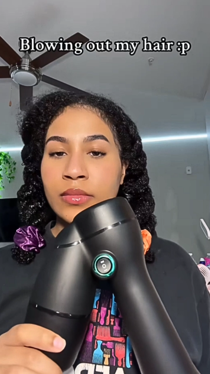 Sleek office blowout for curly hair in a professional setting