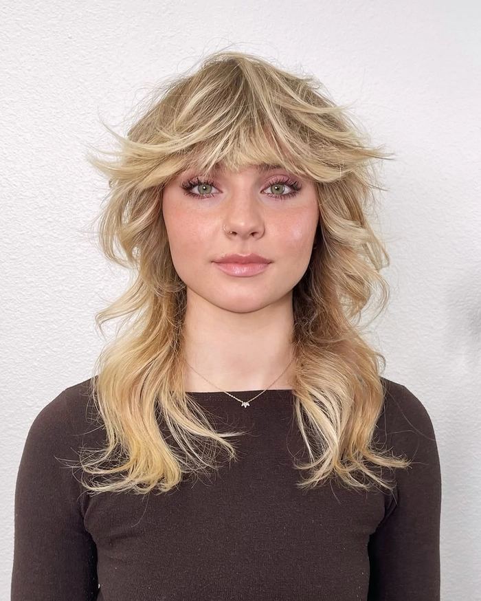 Soft, side-swept bangs softening the strong jawline of a square face for a professional corporate hairstyle