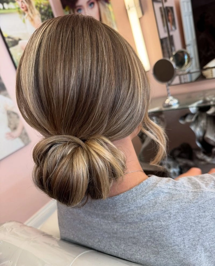 Elegant chignon hairstyle for a female executive in a professional office setting