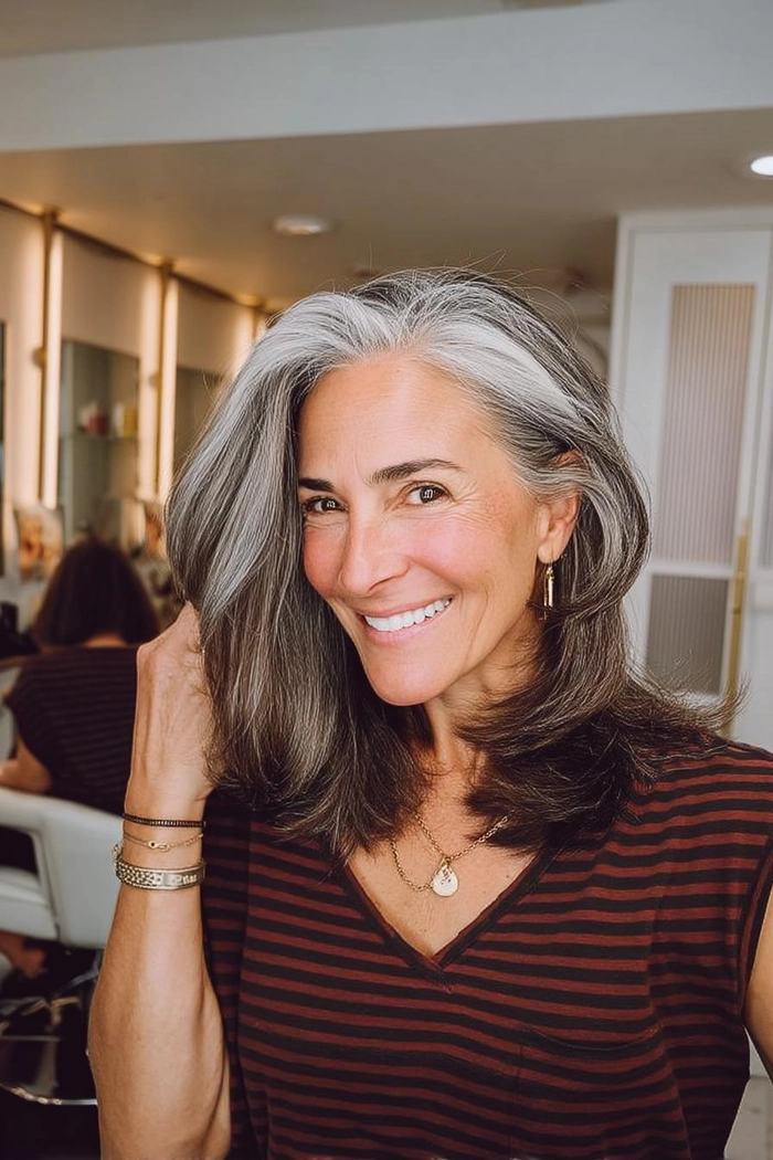 An older executive with a sophisticated blended gray hairstyle