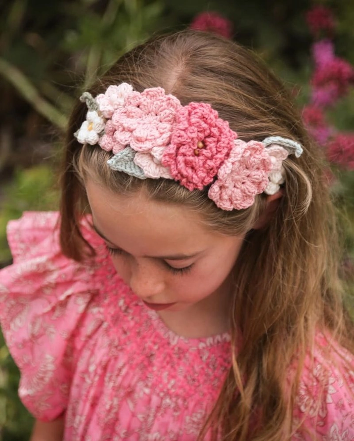Spring floral hair accessory tucked into a casual office ponytail