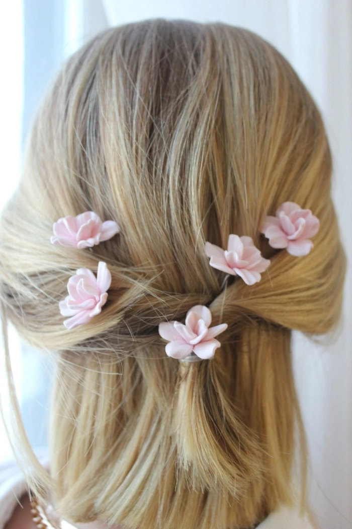 Woman wearing a spring floral hair accessory in a casual office hairstyle