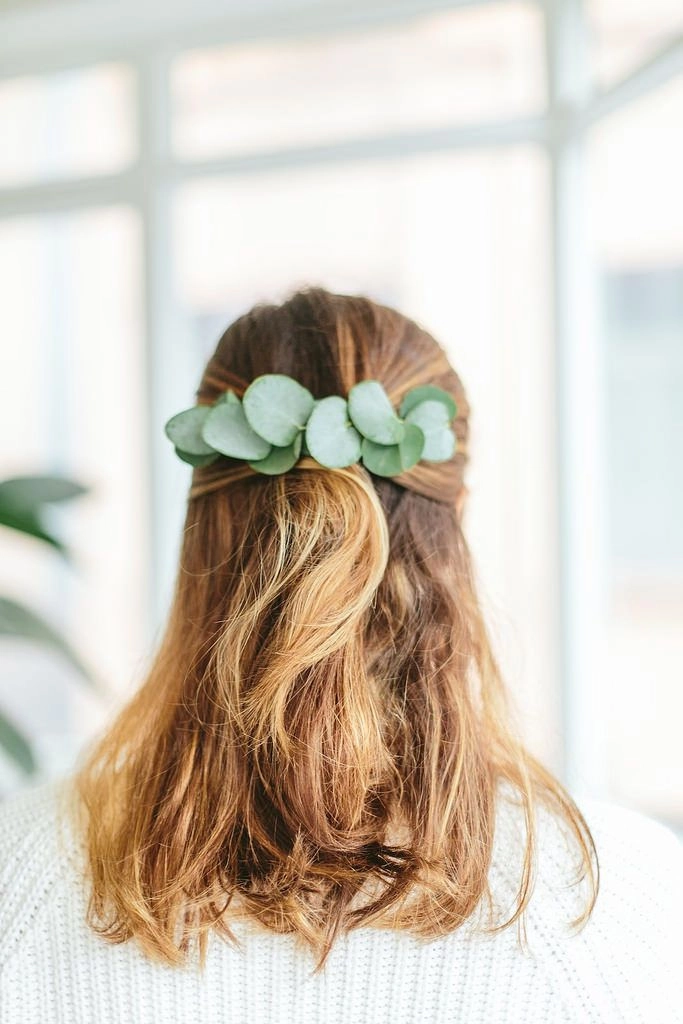 Woman with spring floral hair accessory in casual office hairstyle