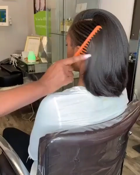 How to maintain a straightened bob hairstyle during a nine-to-five office shift Woman with sleek straightened bob at work, touching up her hairstyle
