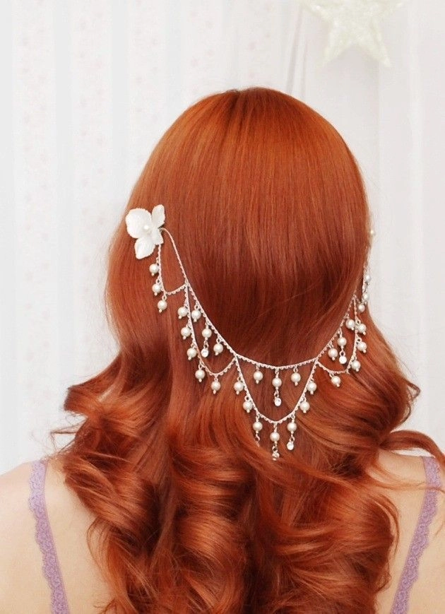 Subtle gold hair jewelry piece nestled in a low chignon for professional workplace style