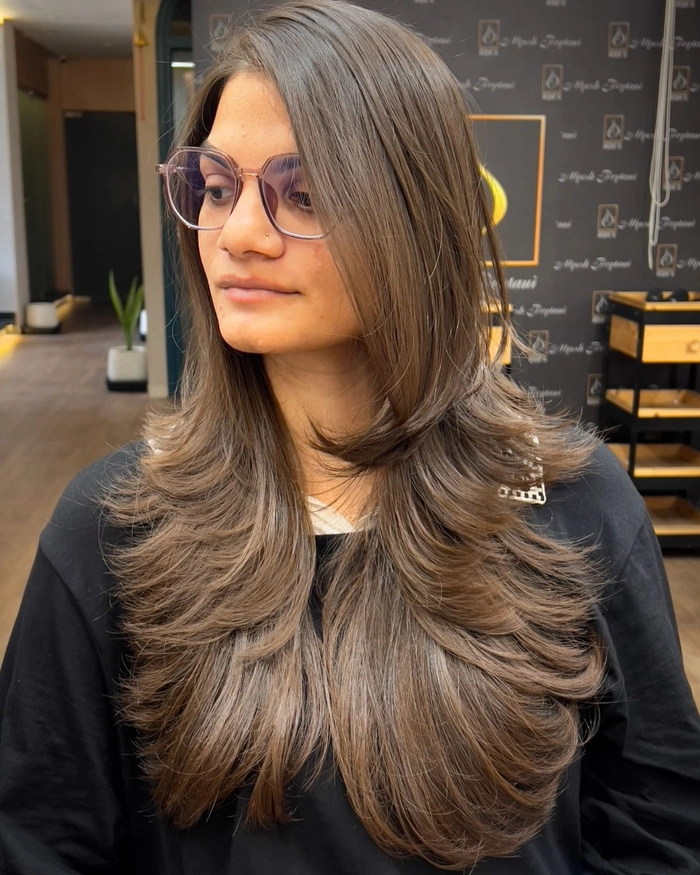 Tamed workspace hairstyle for extra thick hair, neatly pinned