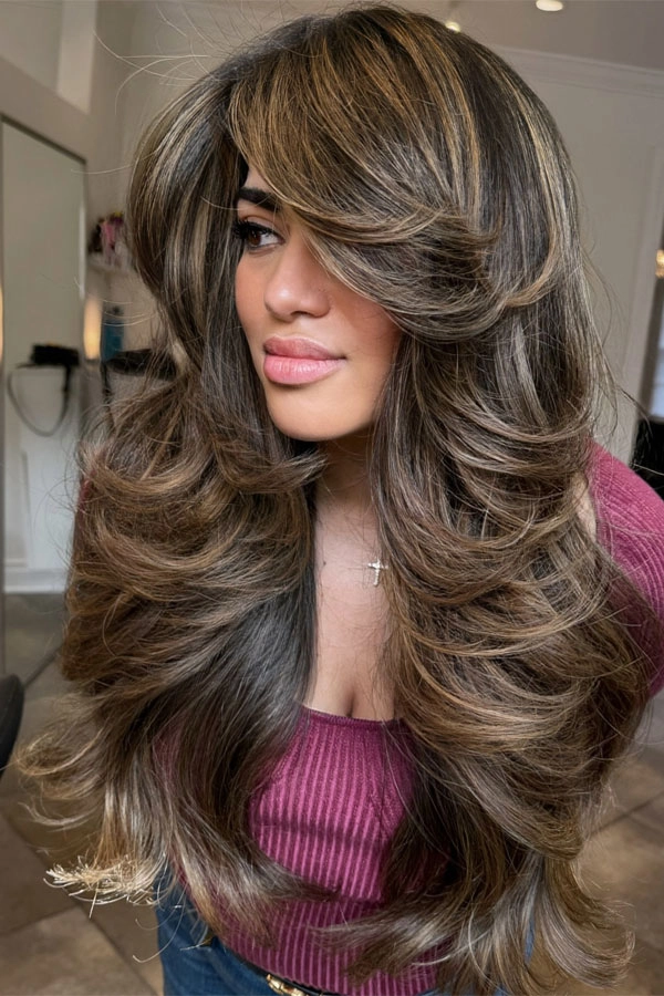 Tamed workspace hairstyle for extra thick hair, side view with sleek low bun