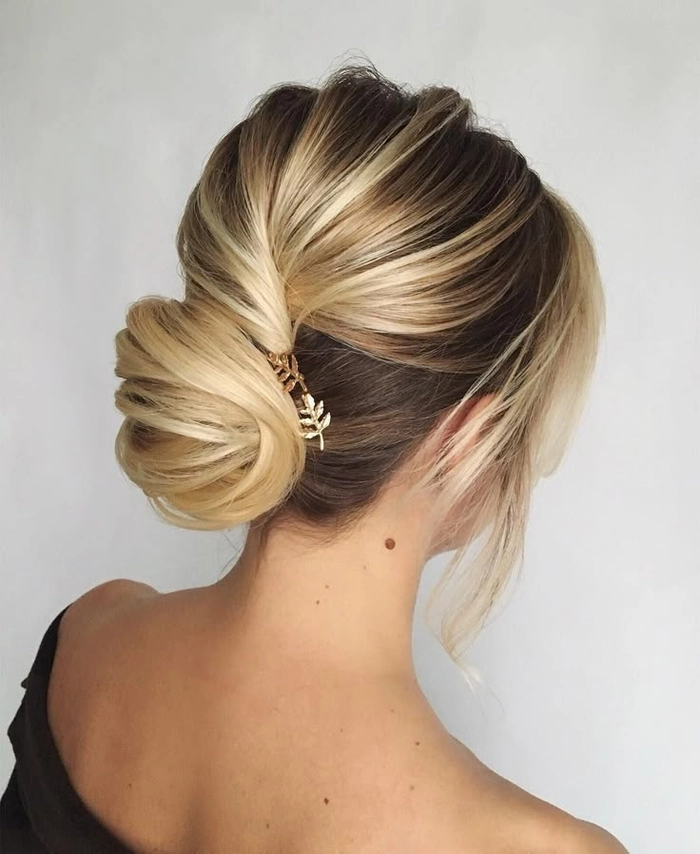 Textured low chignon hairstyle perfect for creative industry meetings