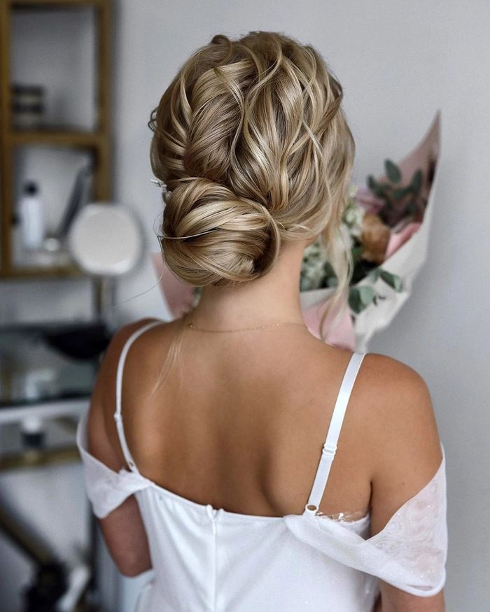 Polished textured low chignon hairstyle for a creative industry meeting