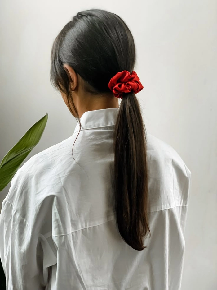 Velvet Scrunchie Styling for Business Casual Ponytails - Work Hairstyle Image 2 Polished business casual ponytail secured with a velvet scrunchie for office style
