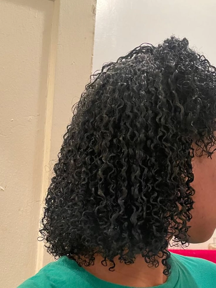 Professional wash and go hairstyle with defined natural curls suitable for office wear