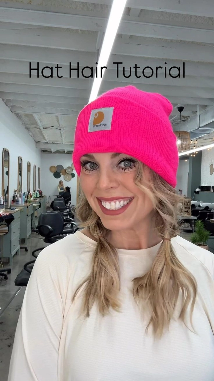 Winter hat hair recovery style for the workplace - neat low bun Woman with a sleek low bun after removing her winter hat, ready for the office